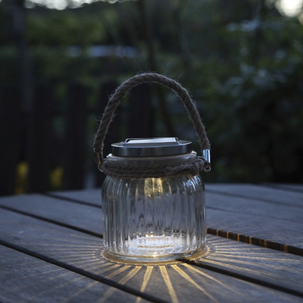 LED Solarglas - geriffeltes Glas - Windlicht mit Juteseil - Lichtsensor - H:11,5cm - transparent